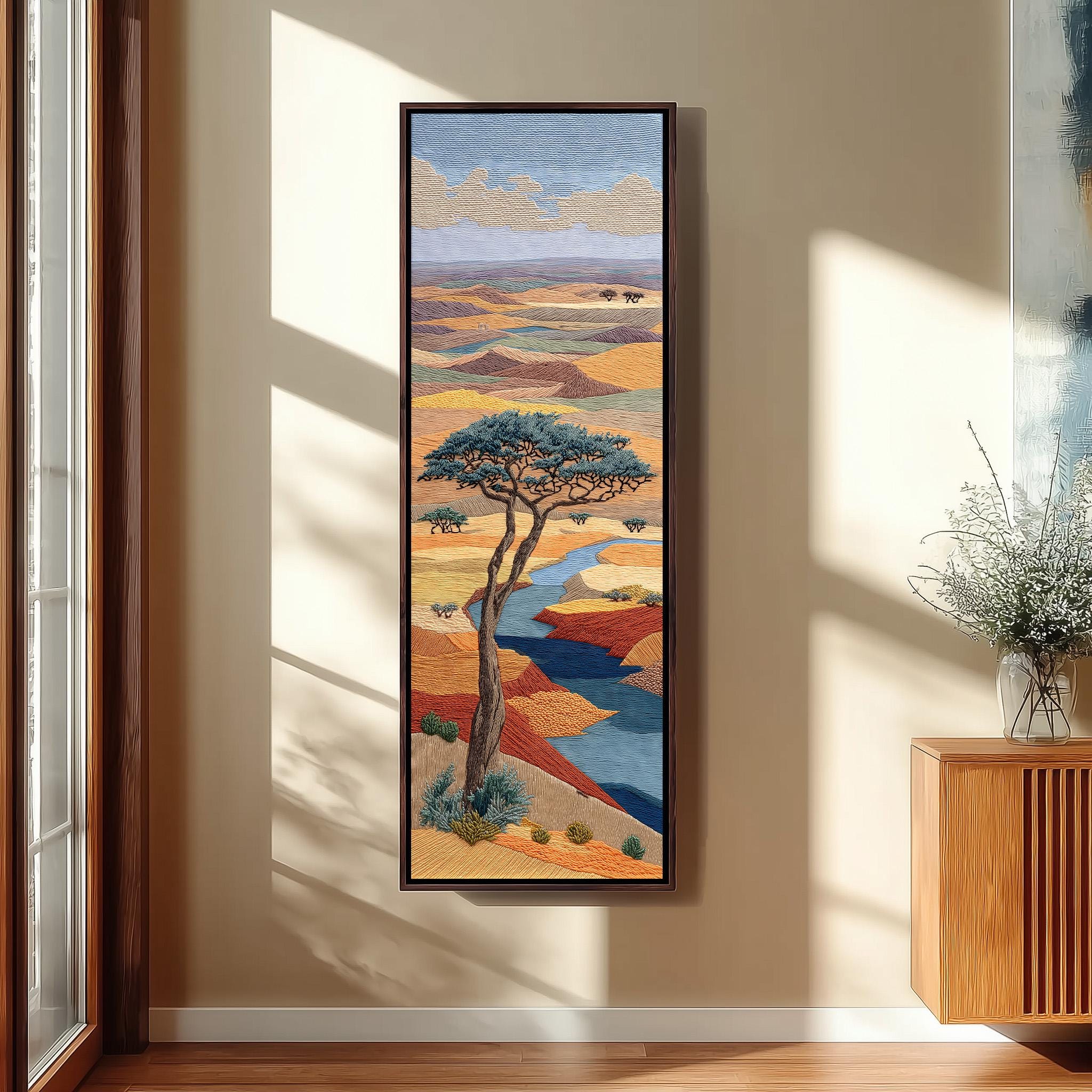 a large, colorful painting of a landscape with a prominent tree in the center. The painting is hanging on a wall, and there is a vase of flowers placed next to it.