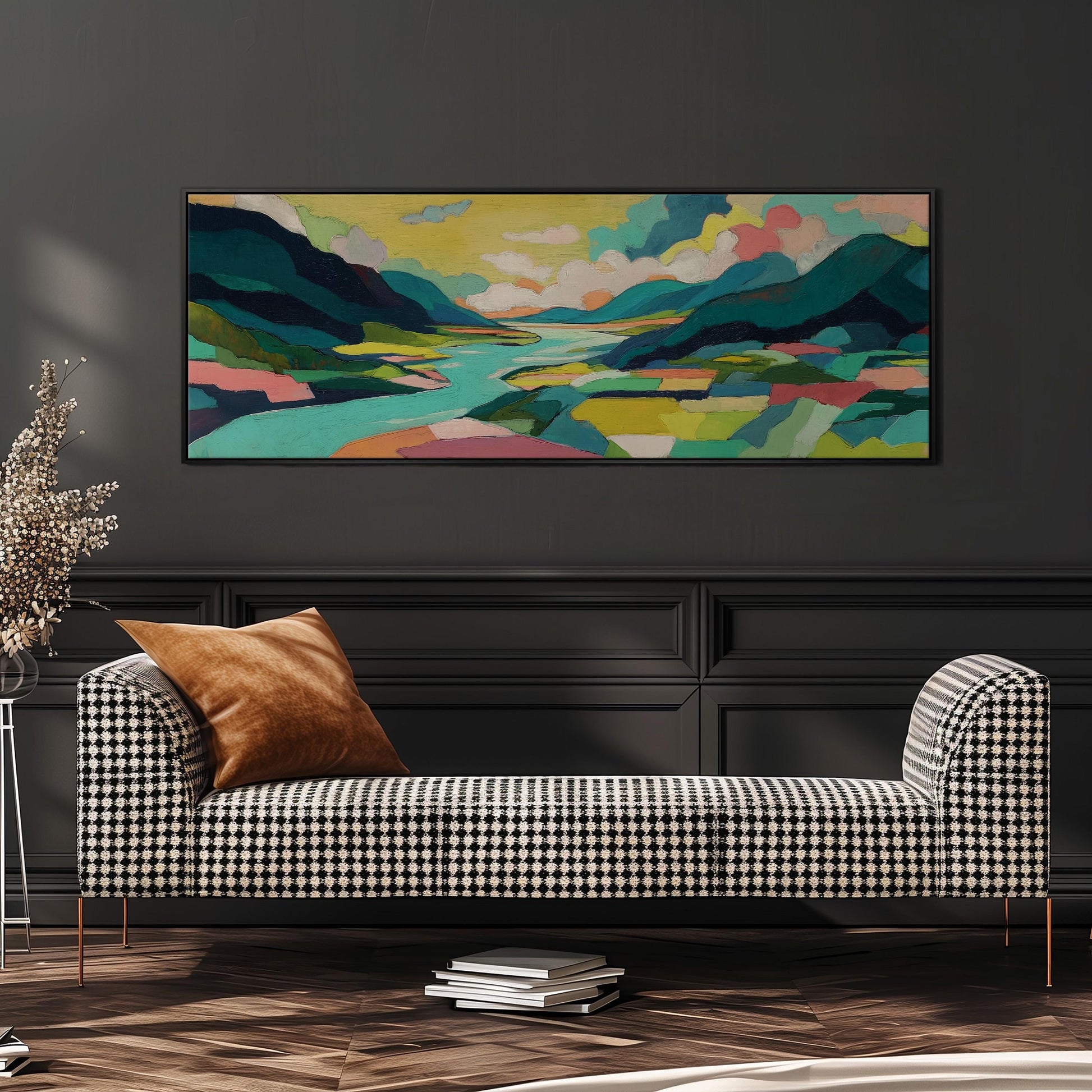 a large, colorful landscape painting hanging on a dark wall above a black and white checkered sofa with a brown throw pillow.
