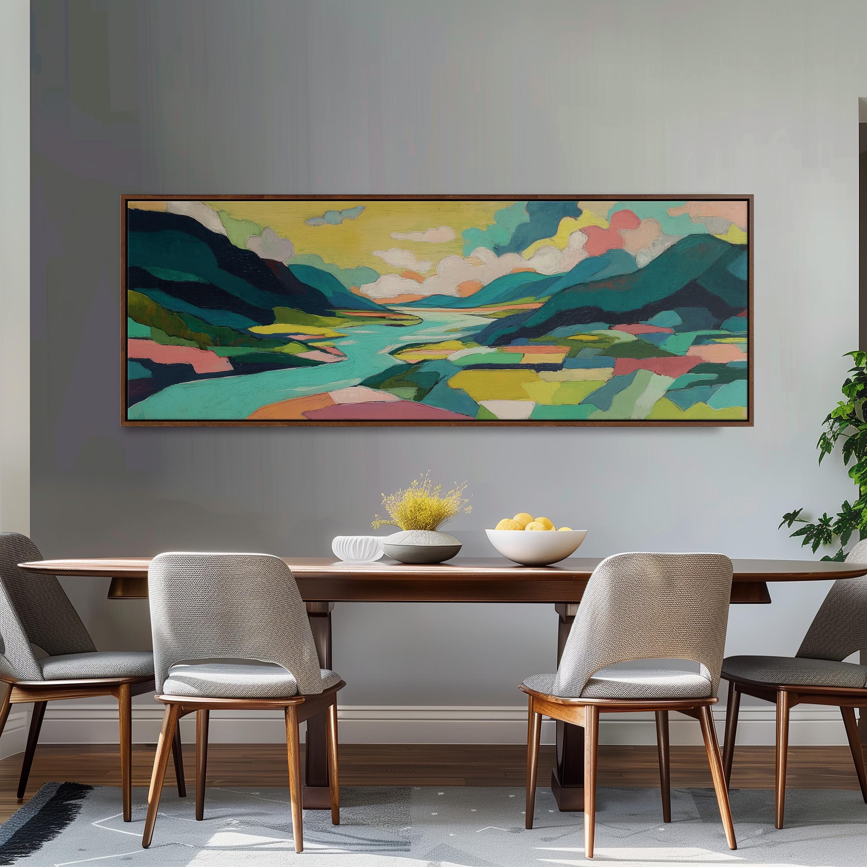 a large, colorful landscape painting hanging on a wall above a wooden dining table with four chairs. The table is set with a bowl of fruit and a vase of flowers, creating a cozy and inviting atmosphere.