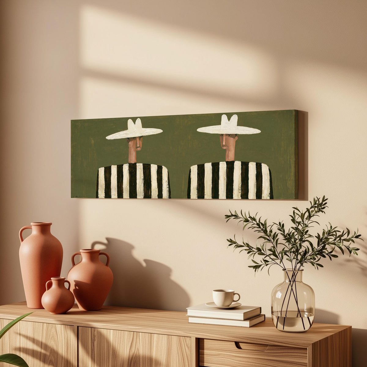 Two figures in striped shirts long horizontal canvas print above a wooden sideboard