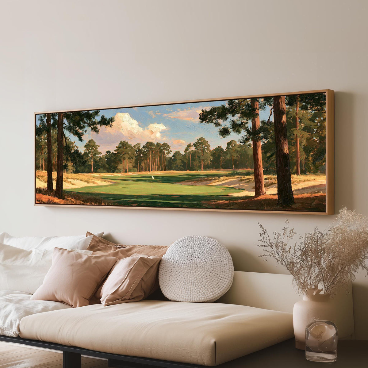Golf fairway lined with tall pines long horizontal canvas print above a sofa in a living room