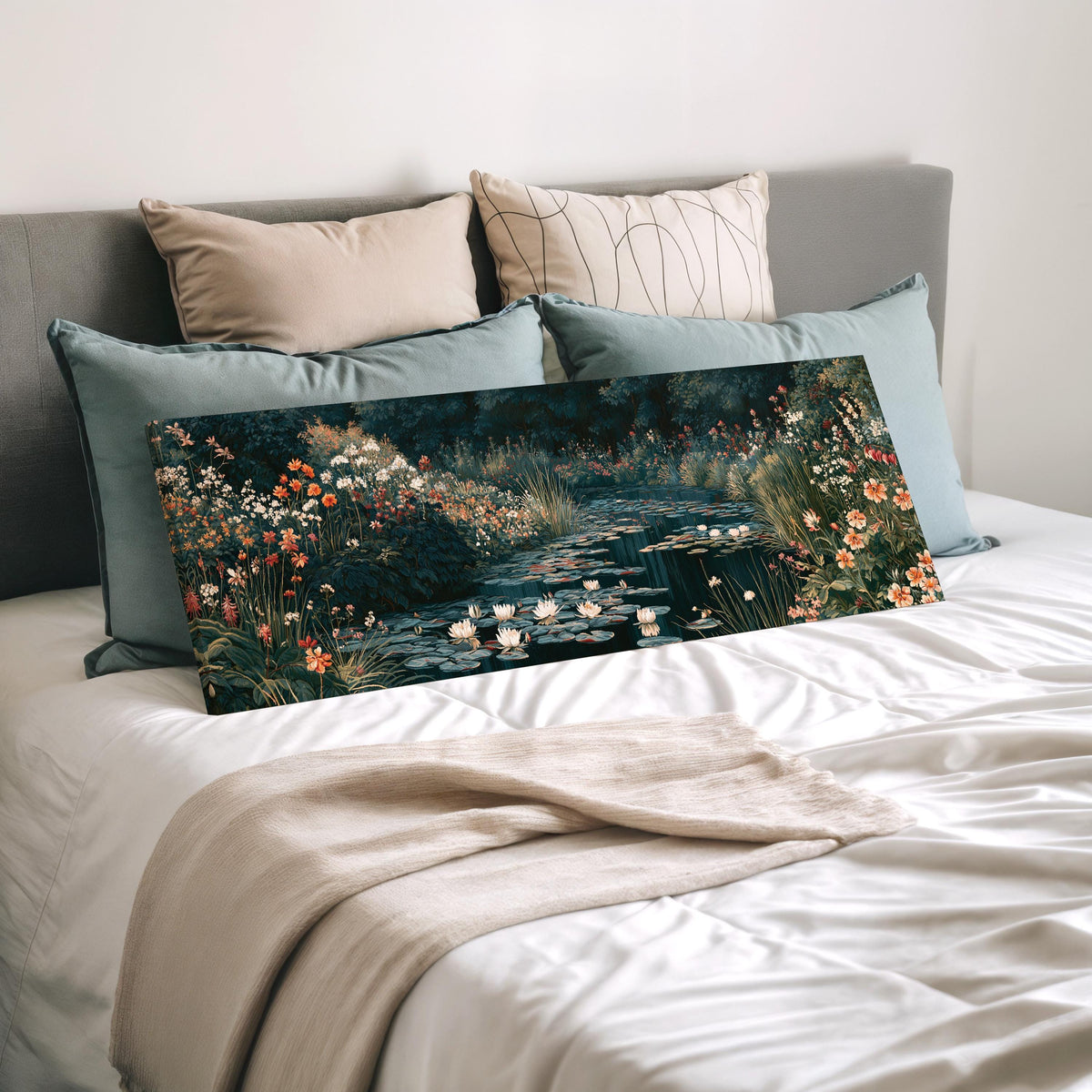 Lily pond surrounded by wildflowers wide panoramic canvas print laid on a bed to show its size
