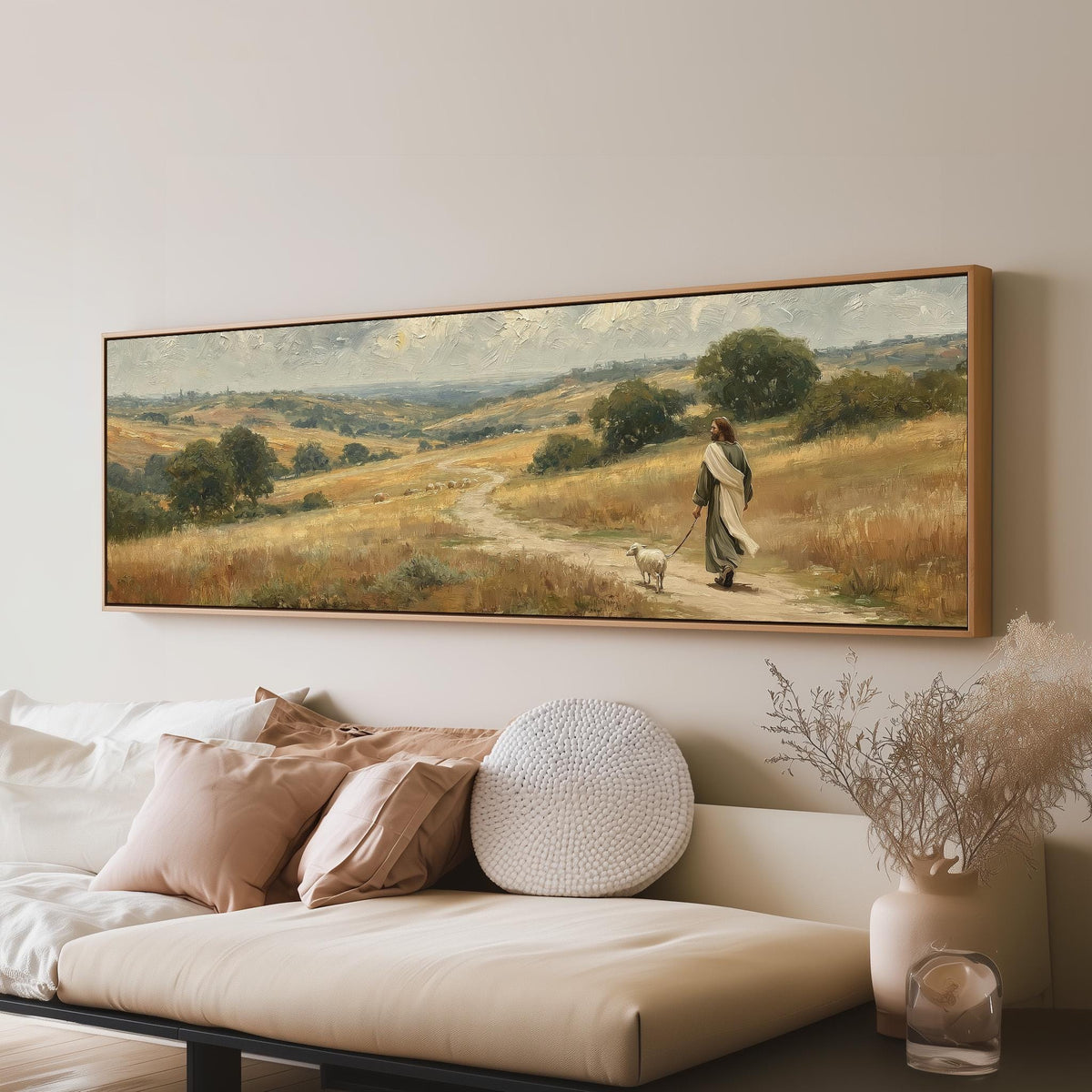 Jesus walking with a sheep on a golden hillside long horizontal canvas print above a sofa in a living room