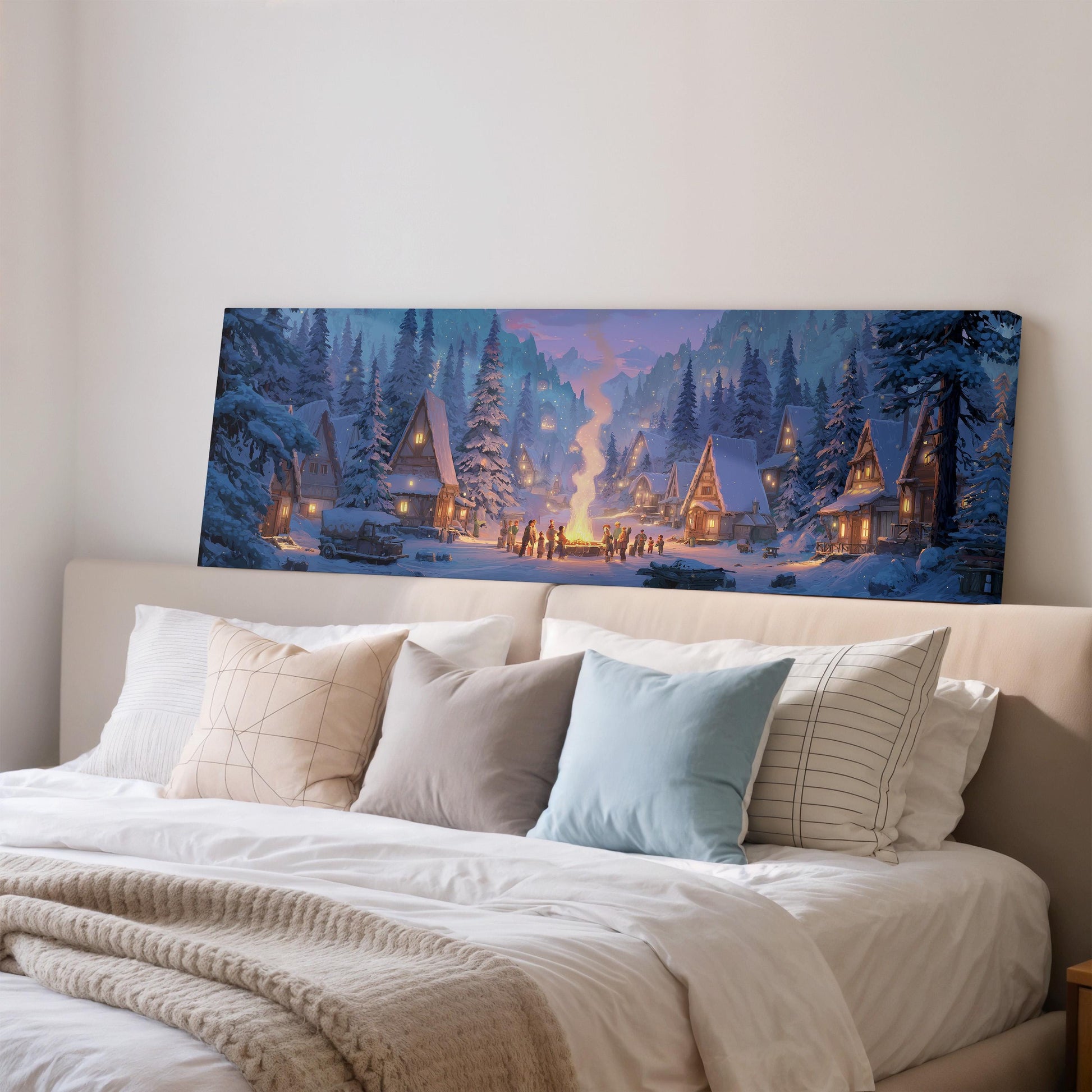 a large, colorful painting of a snowy village scene hanging on a wall above a bed with pillows.