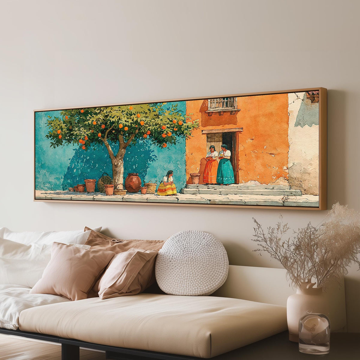 Orange tree on a colorful village street long horizontal canvas print above a sofa in a living room