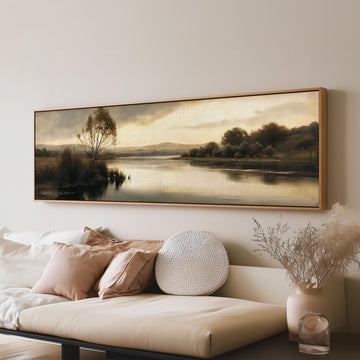 Misty river reflection at dusk long horizontal canvas print above a sofa in a living room