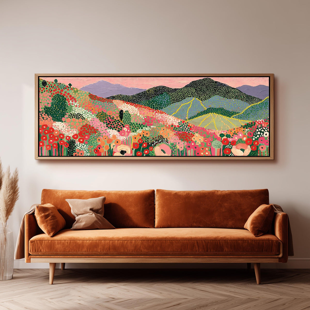 Dotted poppy mountains under a pink sky panoramic canvas print above a sofa in a living room