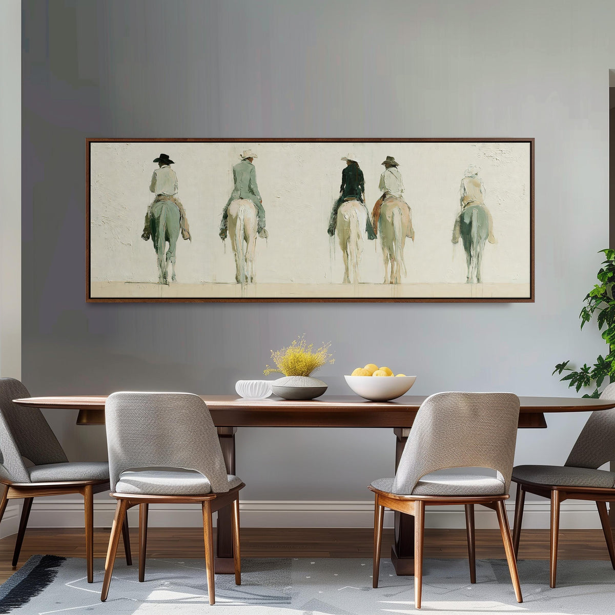 Riders on horseback seen from behind long horizontal canvas print above a dining table