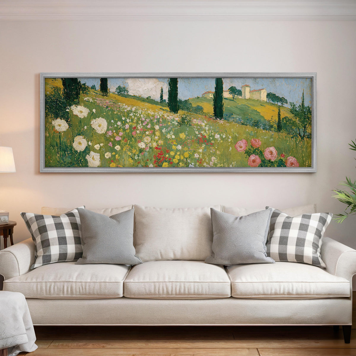 Tuscan wildflower hillside with cypress trees panoramic canvas print above a white sofa in a bright living room