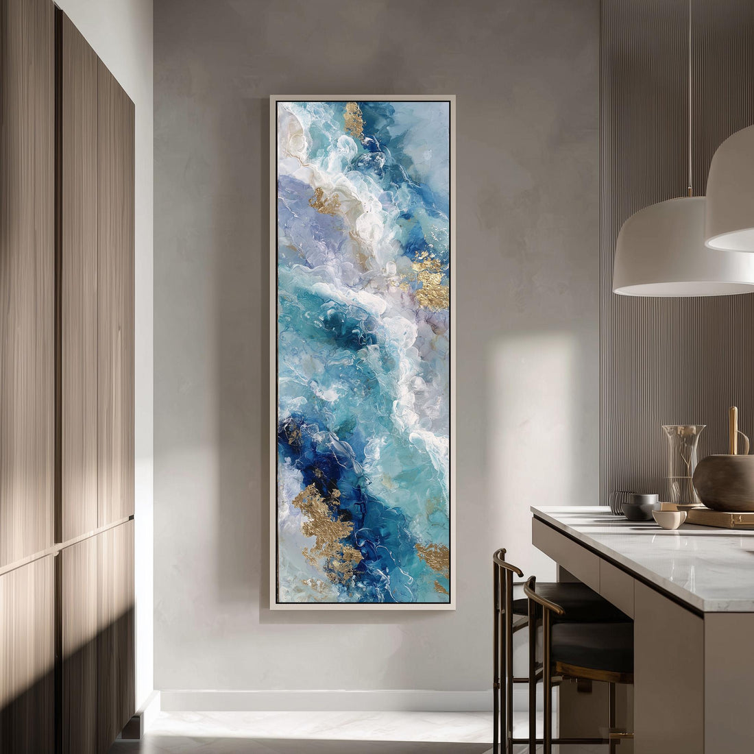 a large, abstract painting hanging on a wall in a modern kitchen. The painting depicts a swirling pattern of blue, white, and gold colors, creating a sense of movement and energy. The kitchen itself has a clean, minimalist design with white cabinets and a marble countertop.
