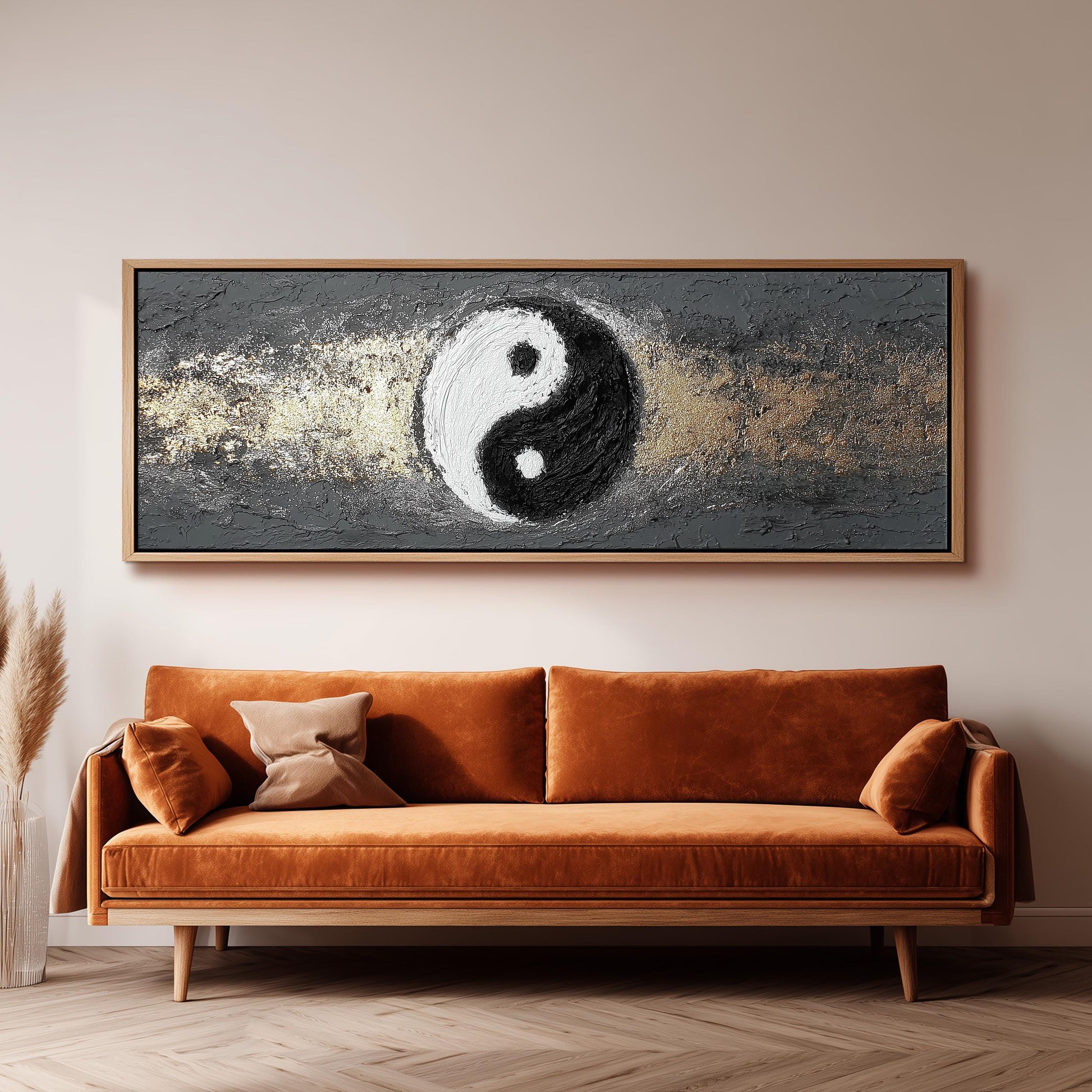 a large, rectangular painting hanging on a wall above a brown sofa.