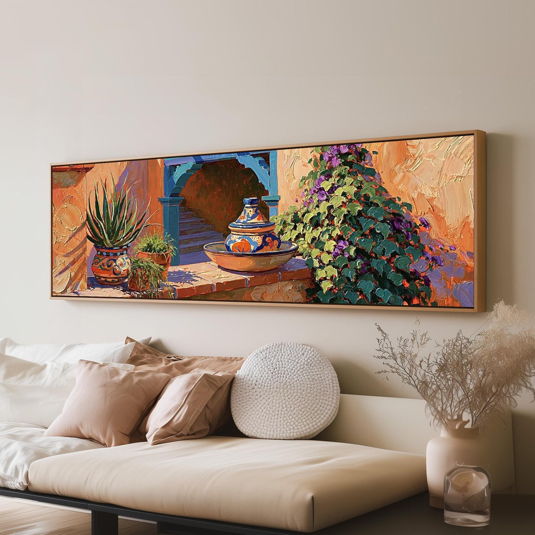 Courtyard corner with Talavera pottery and plants long horizontal canvas print above a sofa in a living room