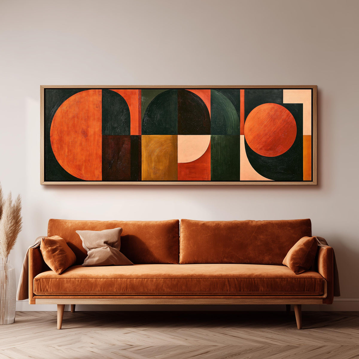 Orange circles and arches on forest green long horizontal canvas print above a sofa in a living room