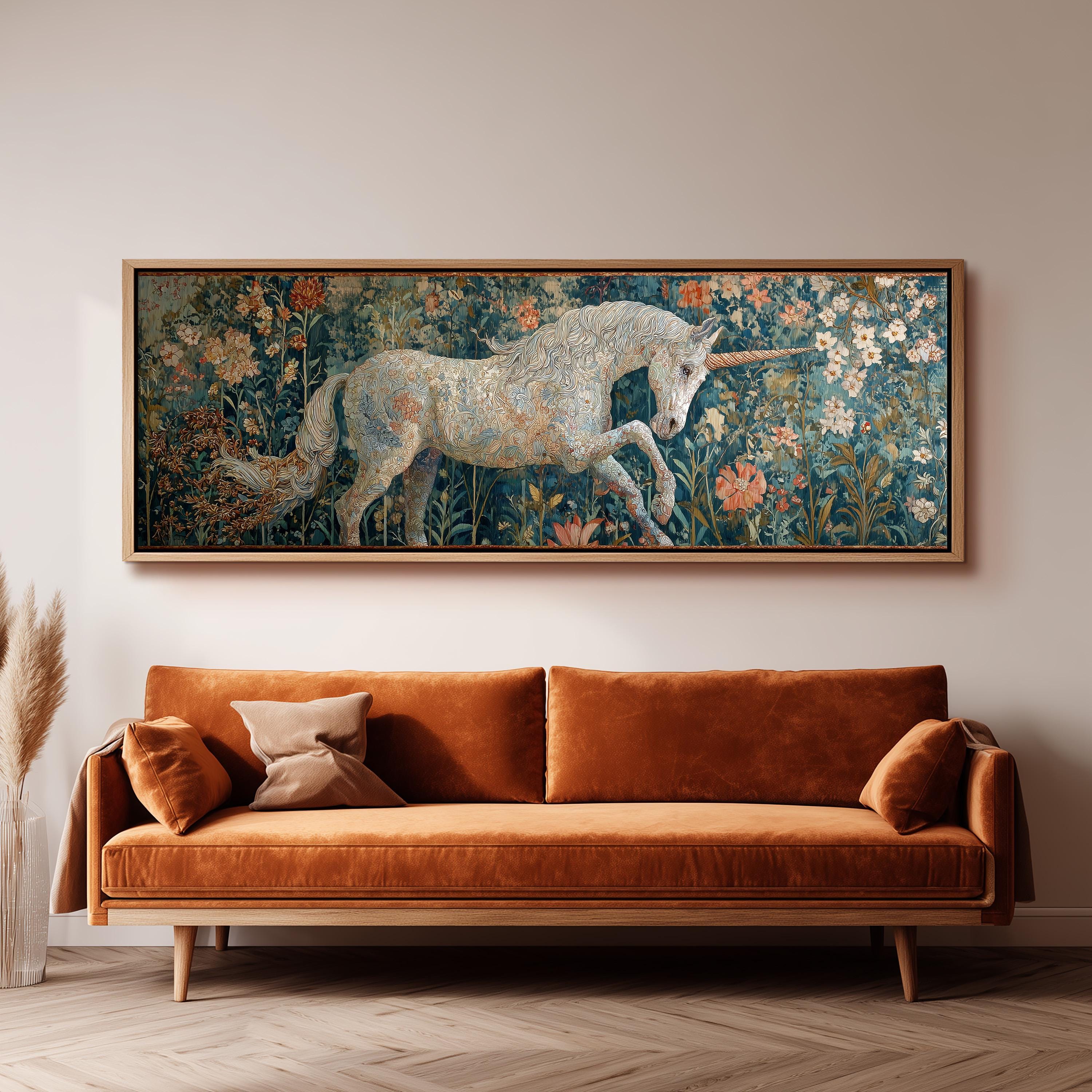 a large painting of a unicorn in a field of flowers hanging on a wall above a brown sofa.