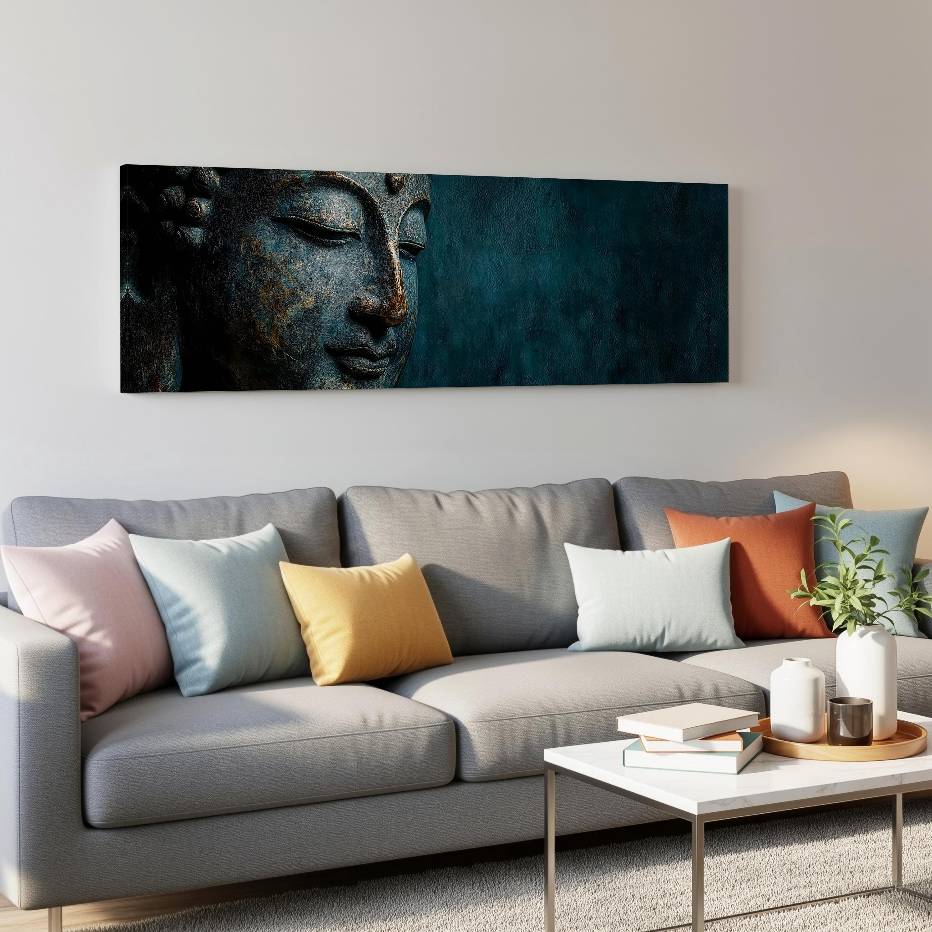 a large, colorful Buddha statue on a wall above a gray couch with various throw pillows.