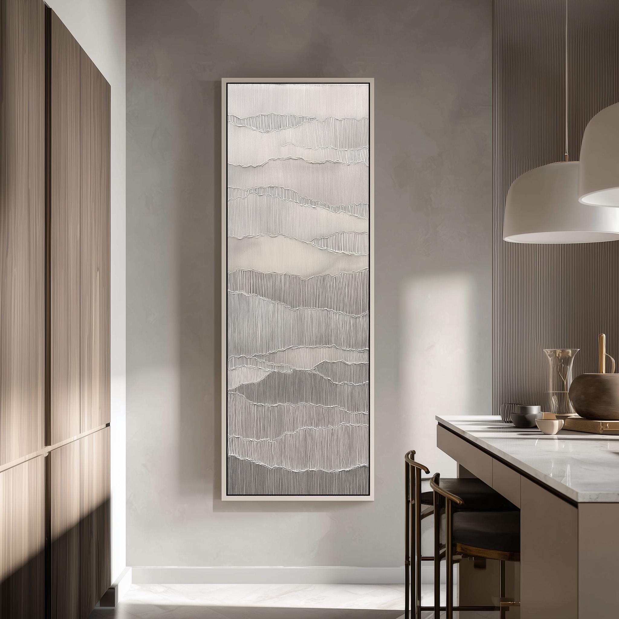 a modern kitchen with a large abstract painting hanging on the wall above a counter. The kitchen has a minimalist design with a white countertop and wooden cabinets.