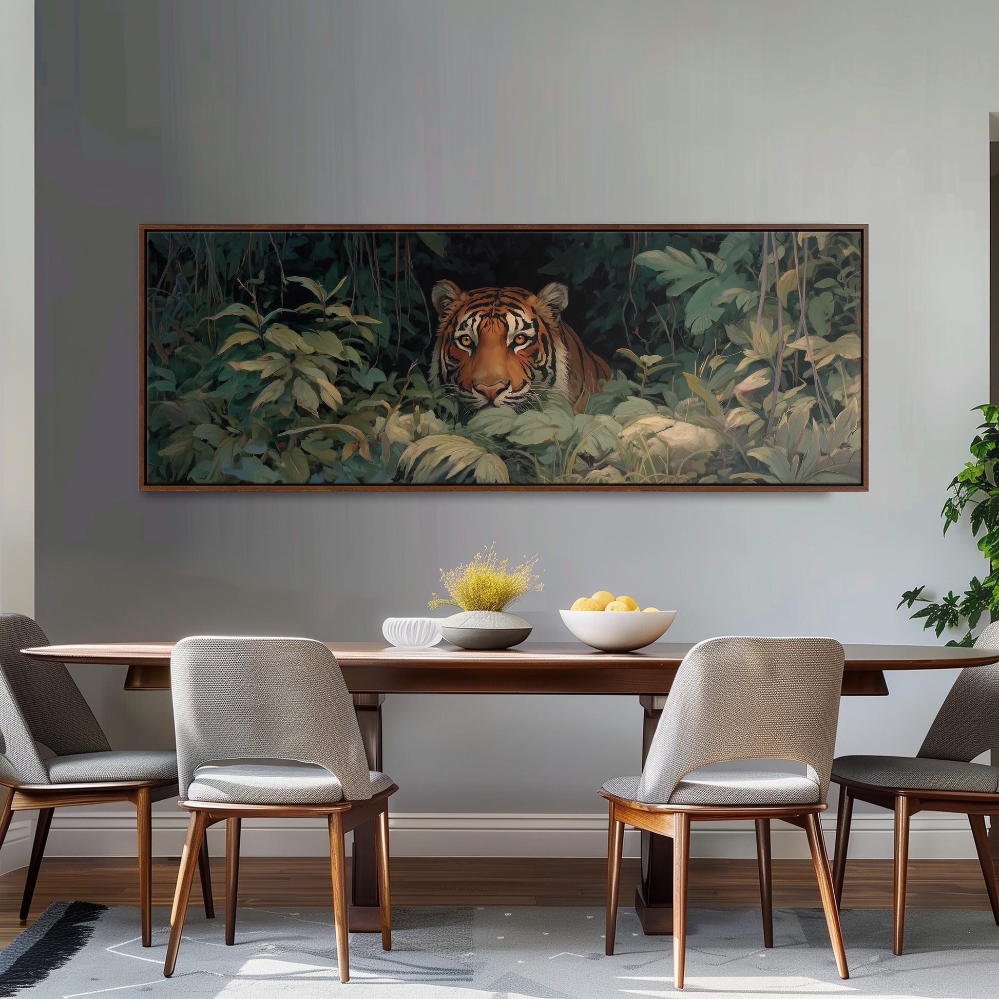 a dining room with a large painting of a tiger on the wall above a wooden table with four chairs. The painting is surrounded by lush greenery, creating a serene and natural atmosphere.
