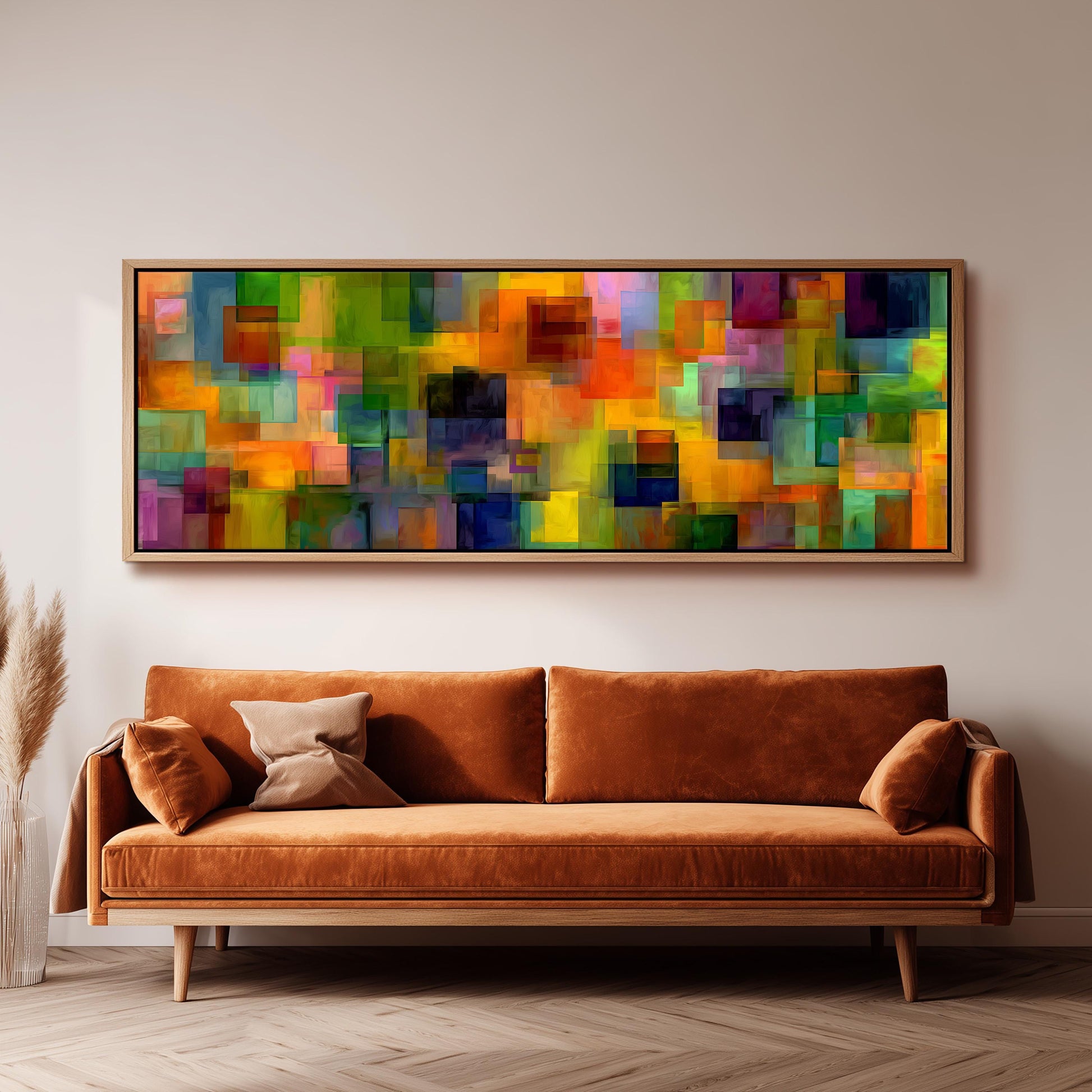 a large, vibrant abstract painting hanging on a wall above a brown sofa in a living room setting.