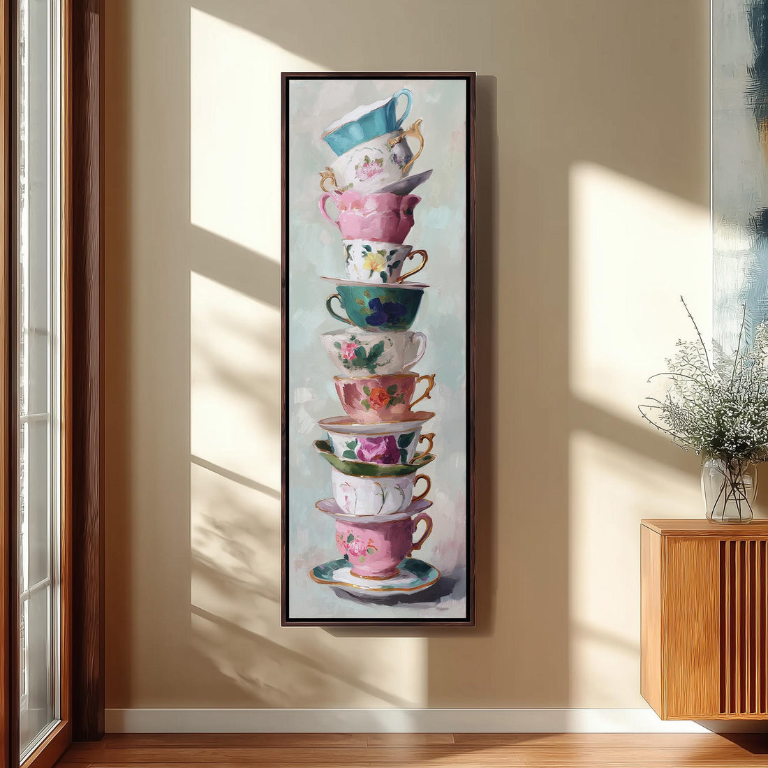 a large, colorful painting of a stack of teacups and saucers on a wall.