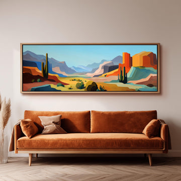 a large, colorful painting of a desert landscape hanging on a wall above a brown sofa.