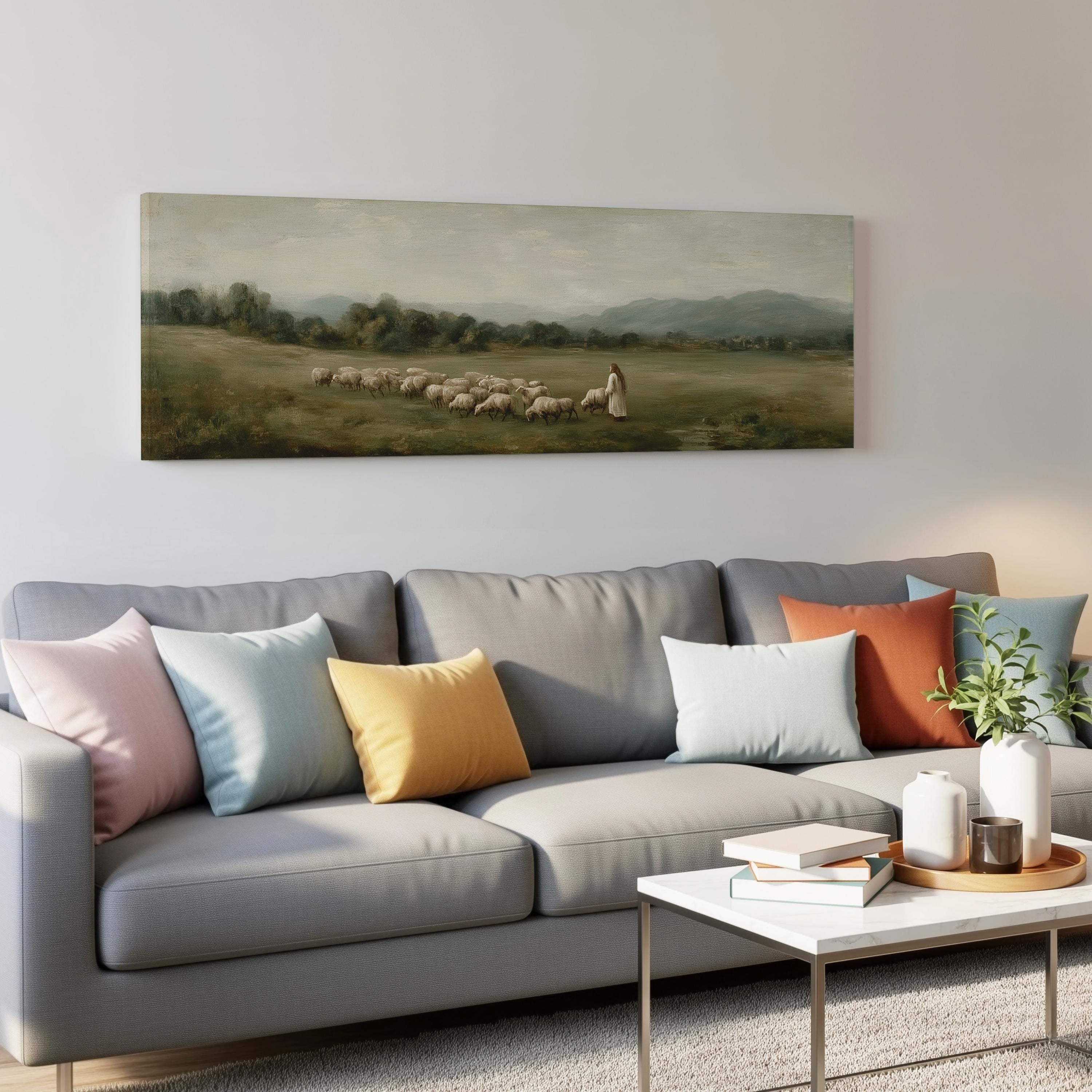 a living room with a gray sofa adorned with colorful throw pillows, a coffee table, and a painting of a pastoral scene hanging on the wall above the sofa.