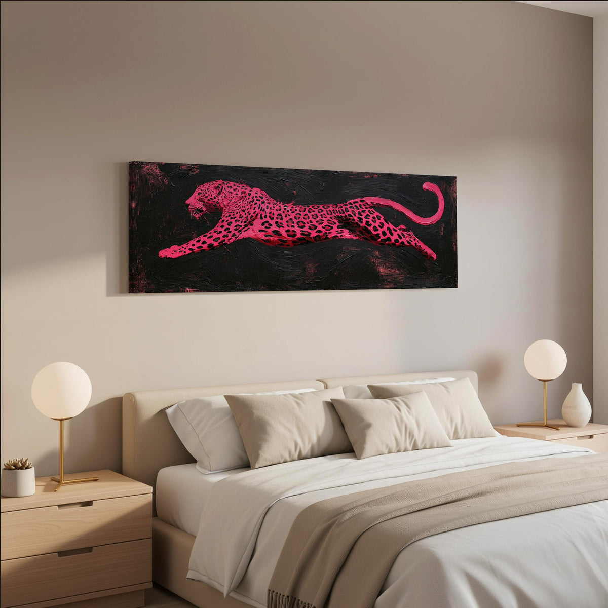 Pink leaping leopard wide panoramic canvas print above a bed in a neutral bedroom