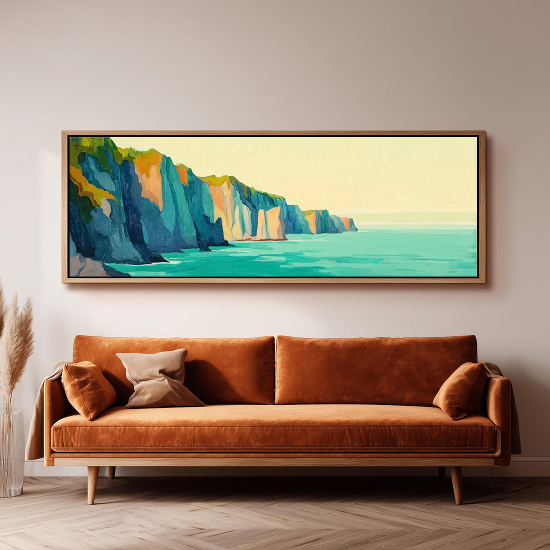a large, colorful painting of a cliff overlooking the ocean, hanging on a wall above a brown sofa.
