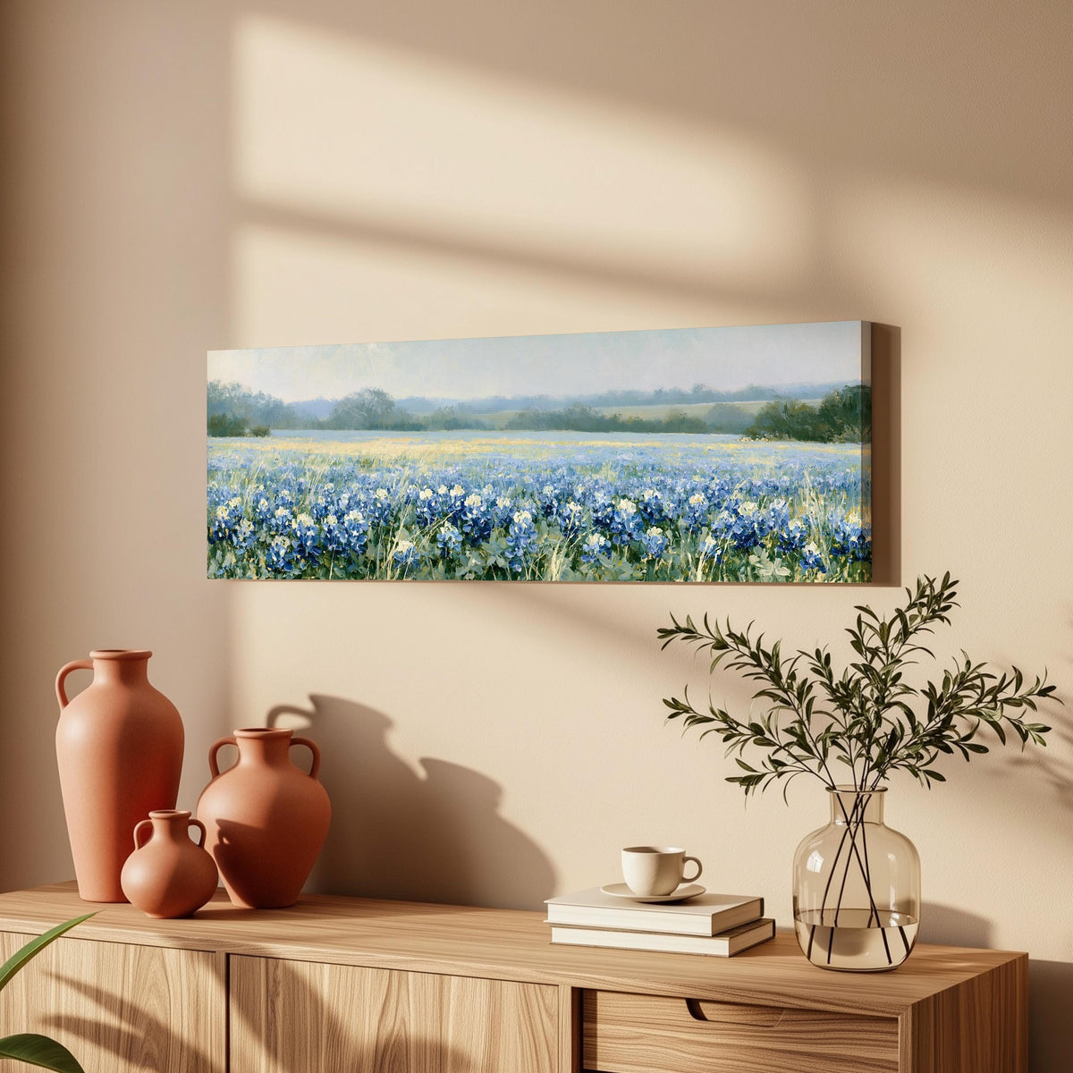 Field of bluebonnets long horizontal canvas print above a wooden sideboard