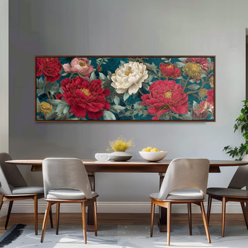a dining room with a large floral painting hanging on the wall above a wooden table with four chairs. The painting displays a vibrant array of red, pink, and white flowers, creating a lively and colorful atmosphere in the room.