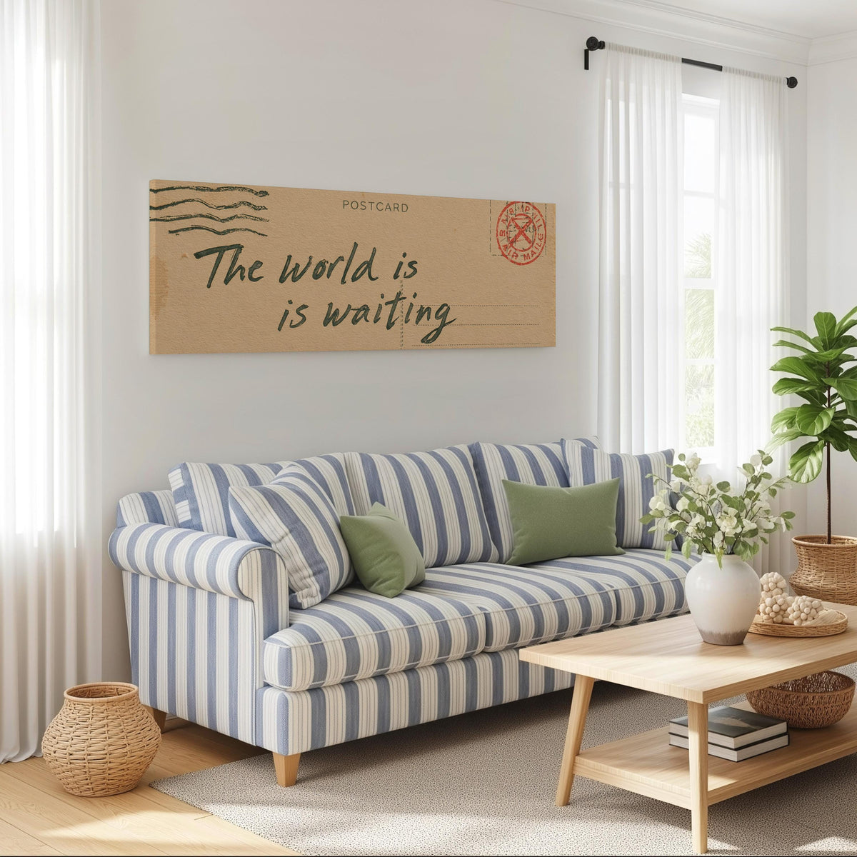 Vintage postcard saying the world is waiting long horizontal canvas print above a striped sofa in a coastal living room