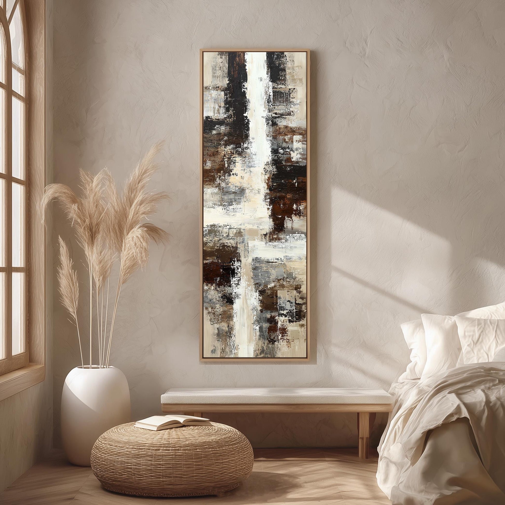 a serene and modern bedroom with a large abstract painting hanging on the wall, a white bed with a white pillow, a white vase with tall potted plants, and a woven ottoman.