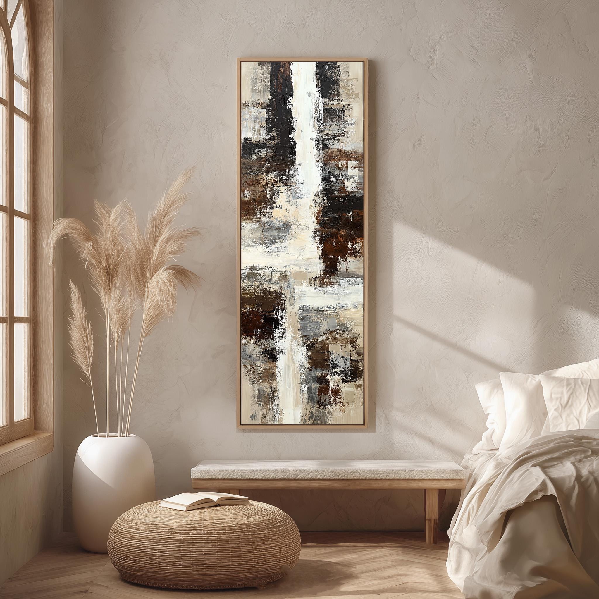 a serene and modern bedroom with a large abstract painting hanging on the wall, a white bed with a white pillow, a white vase with tall potted plants, and a woven ottoman.