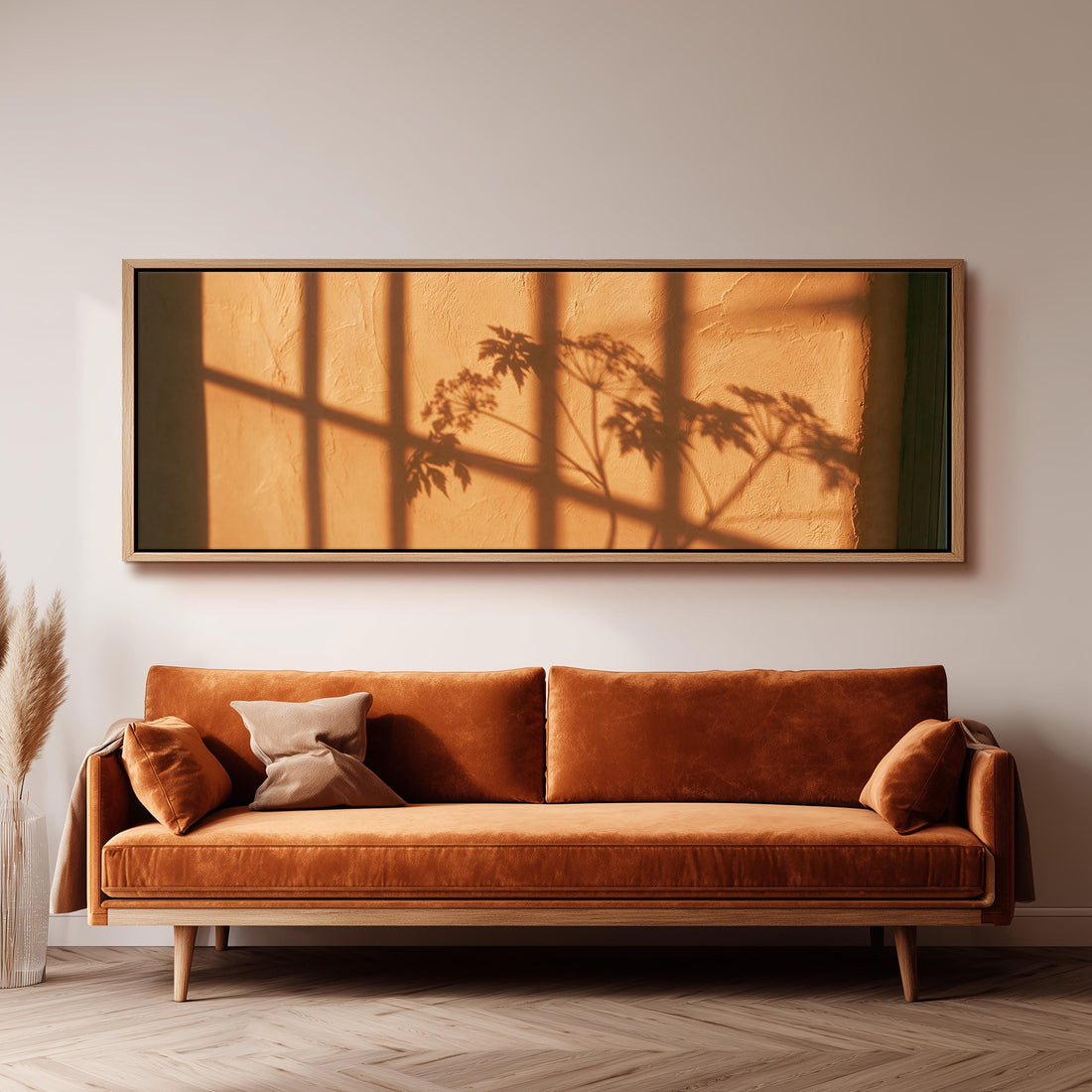 Plant and window shadows on a terracotta wall long horizontal canvas print above a sofa in a living room