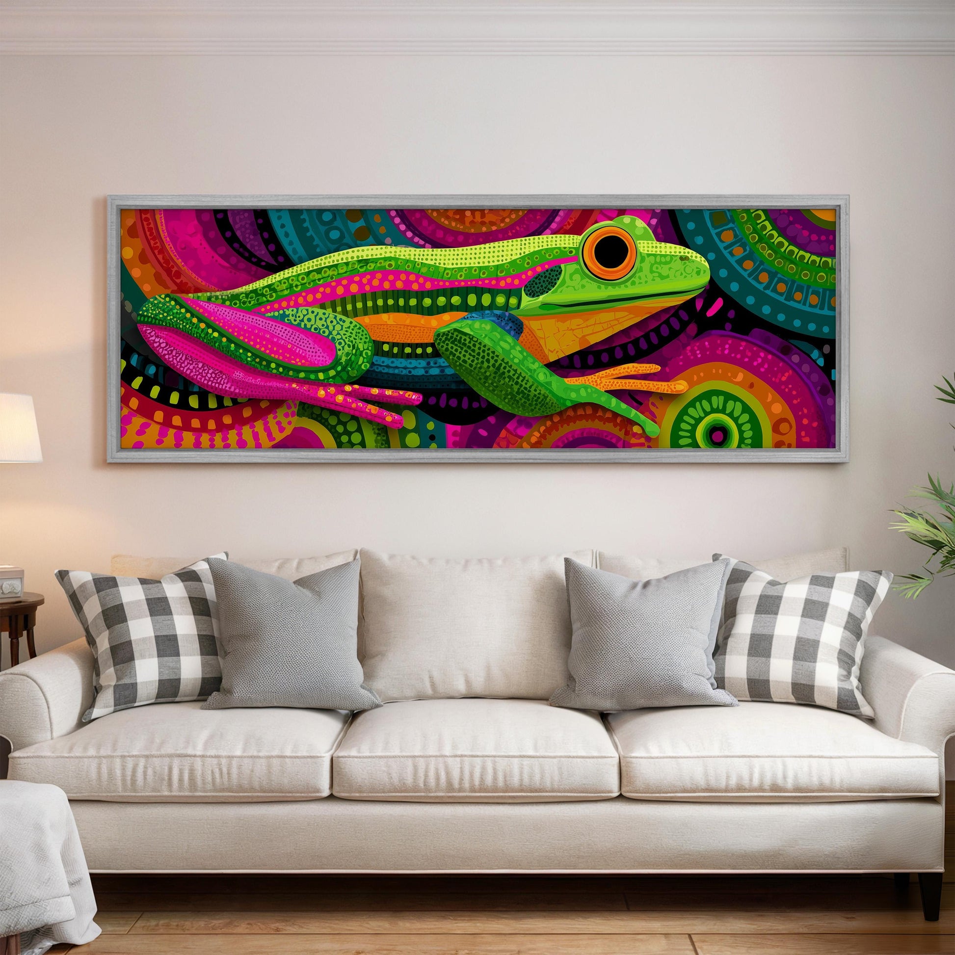 a large, colorful painting of a frog hanging on a wall above a white couch in a living room.