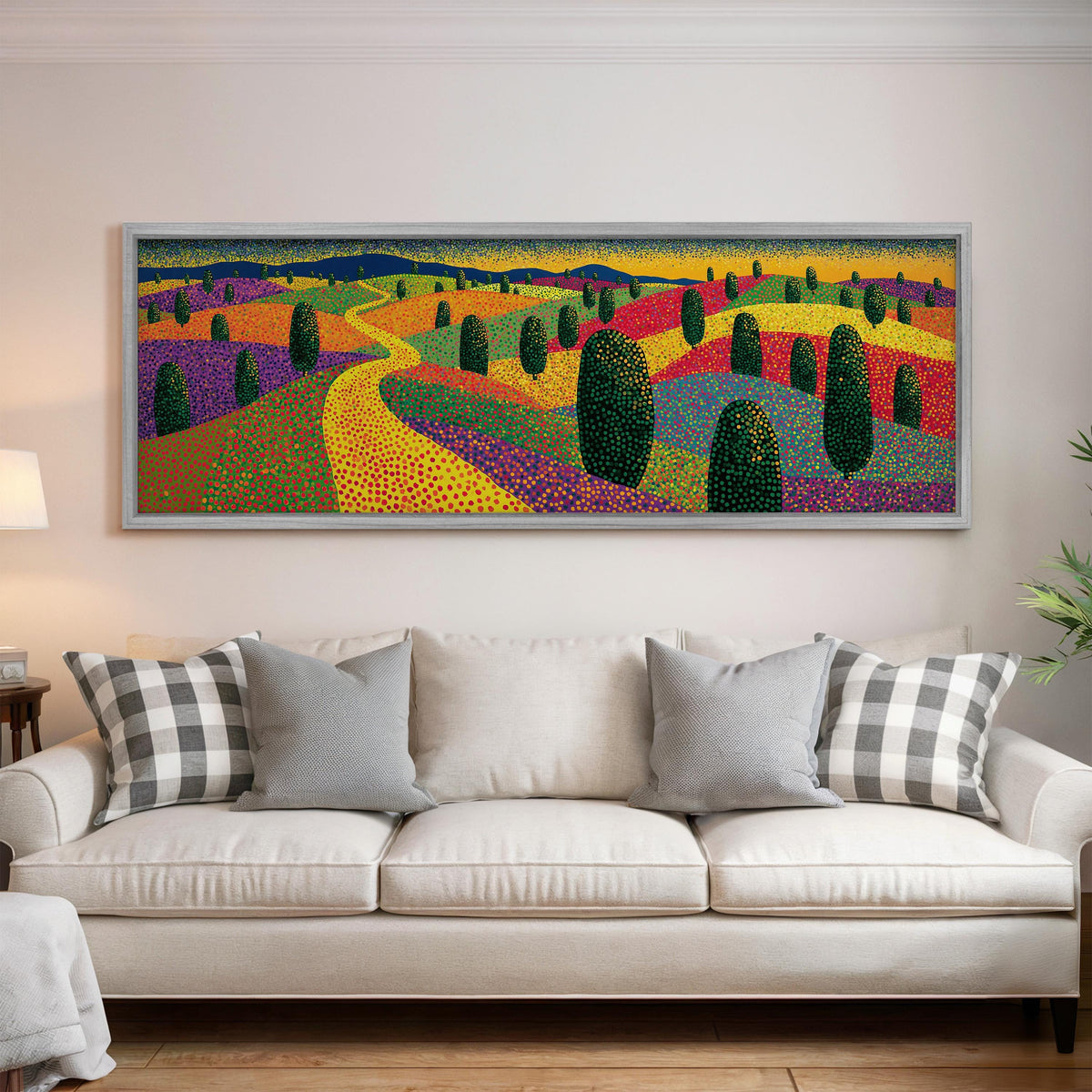 Colorful dotted garden with a winding path panoramic canvas print above a white sofa in a bright living room