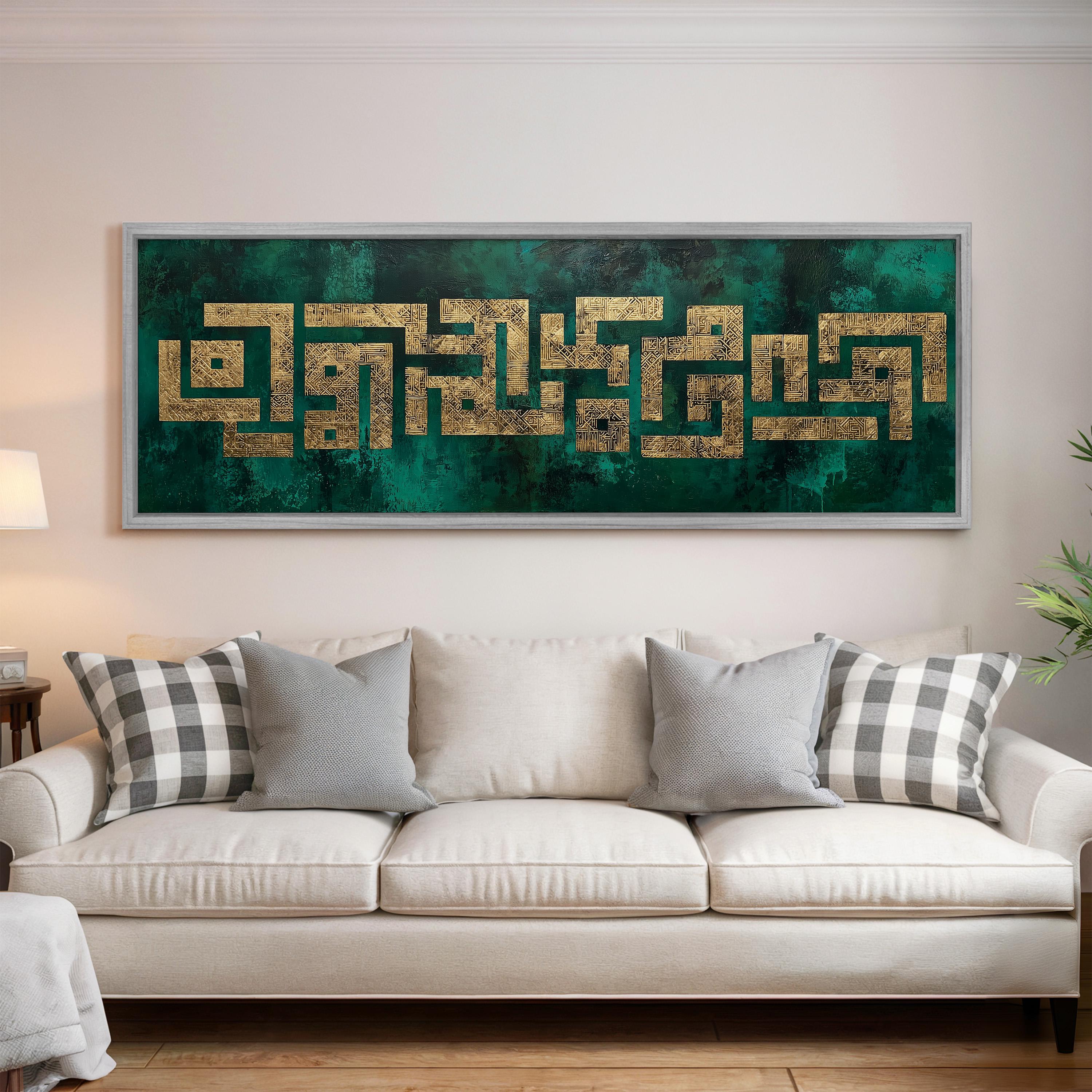 a large framed artwork hanging on a wall above a white couch with decorative pillows.