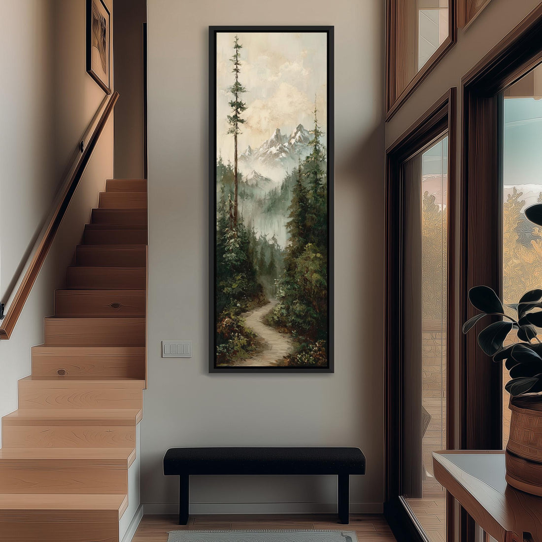 a large painting of a forest scene hanging on a wall, with a wooden cabinet and a vase of flowers placed next to it.