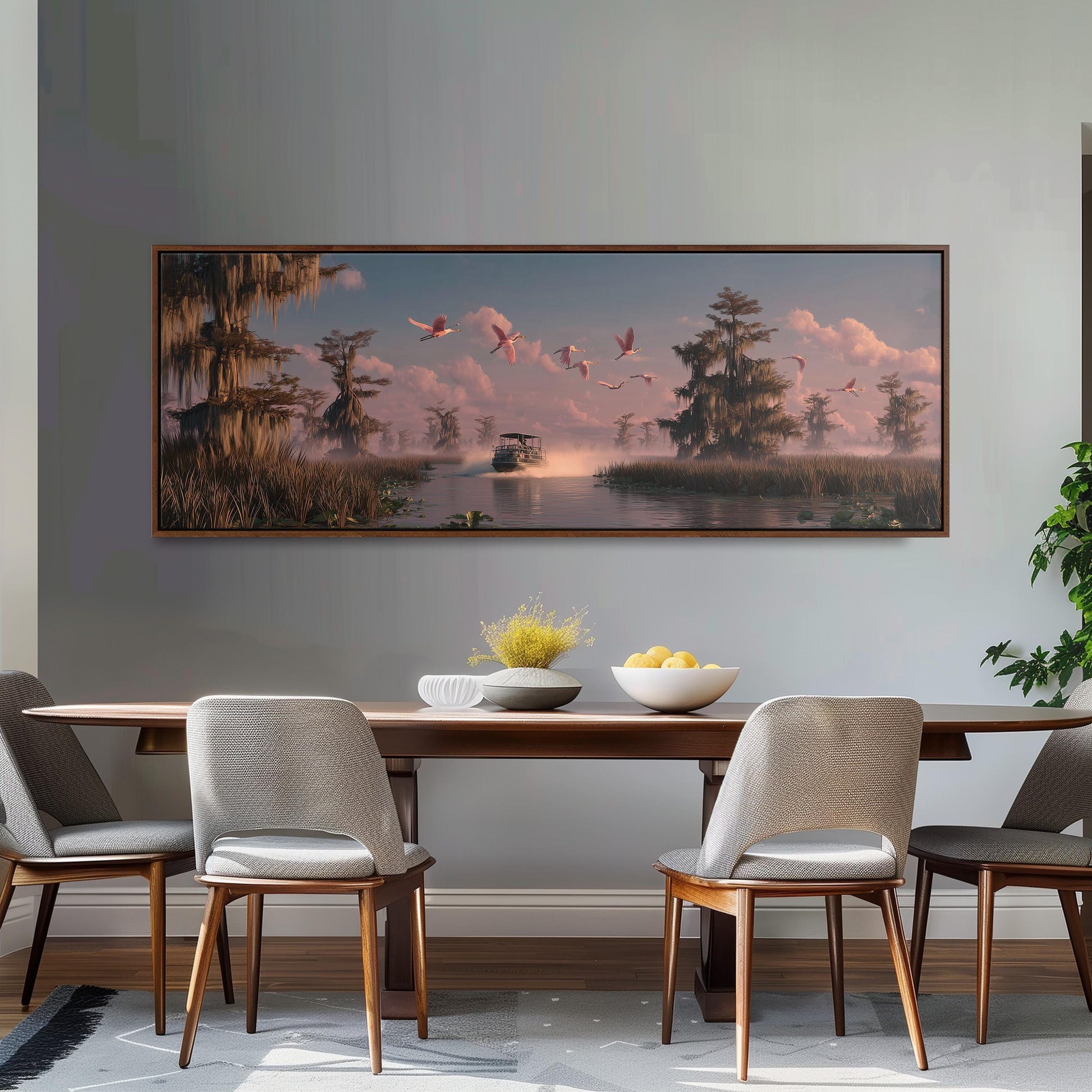 a large painting of a serene landscape with a river, trees, and birds in flight, hanging on a wall above a wooden dining table with four chairs.