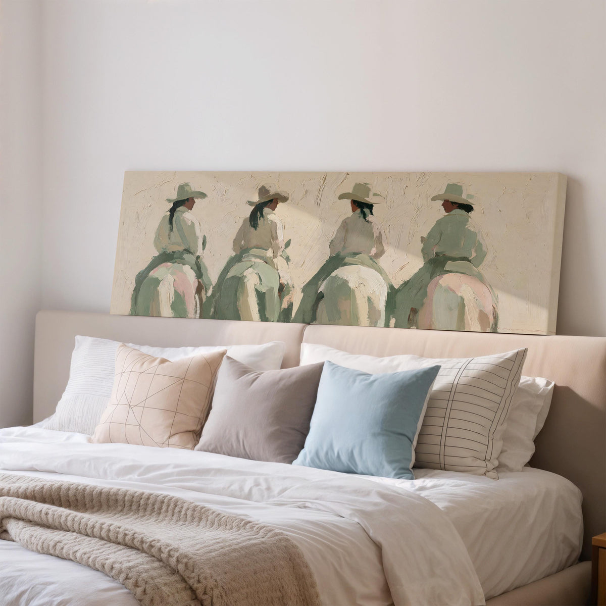 Cowgirl trail riders wide panoramic canvas print above a bed in a bedroom