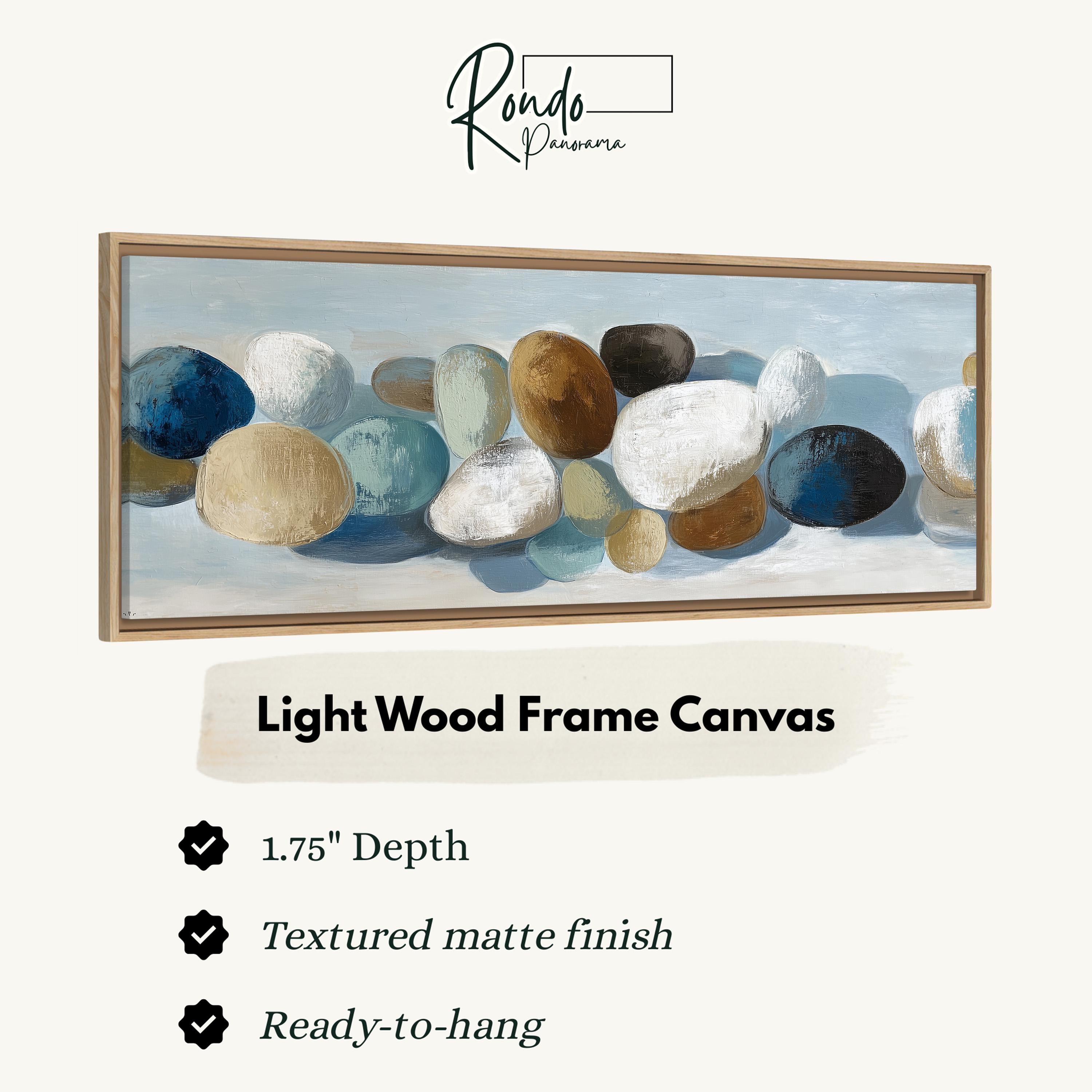 The image is a light wood frame canvas featuring a painting of various colored rocks.