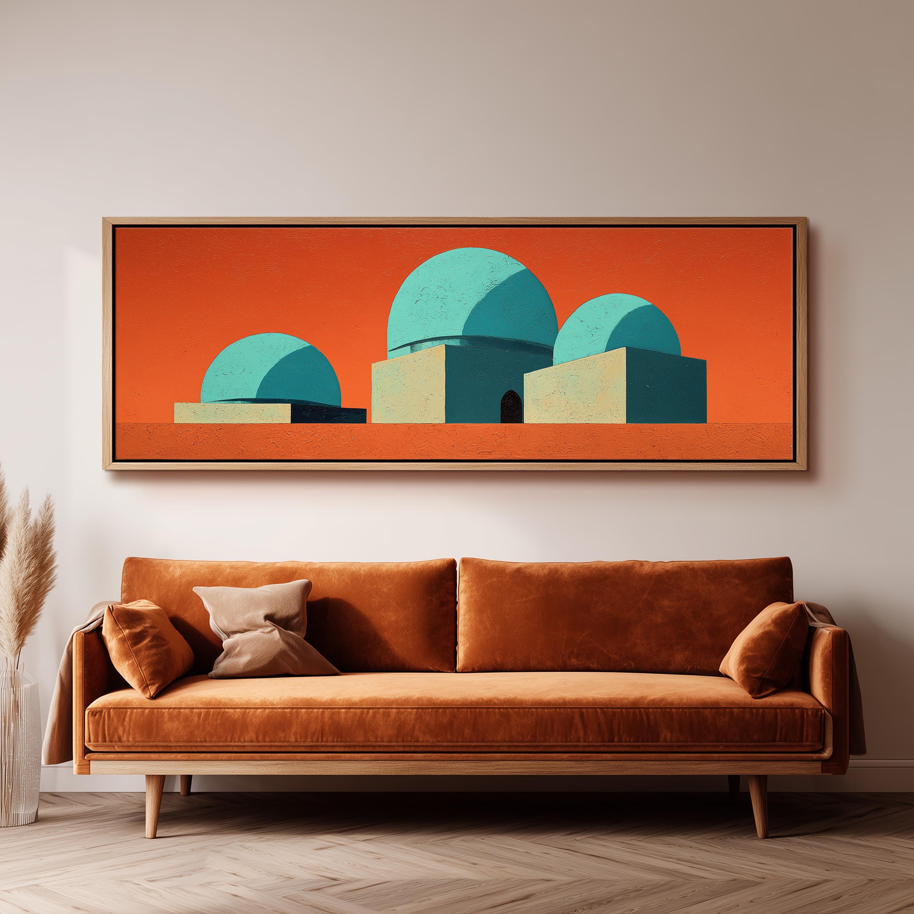 a large, abstract painting of three domes in shades of blue and orange, hanging on a wall above a brown sofa.