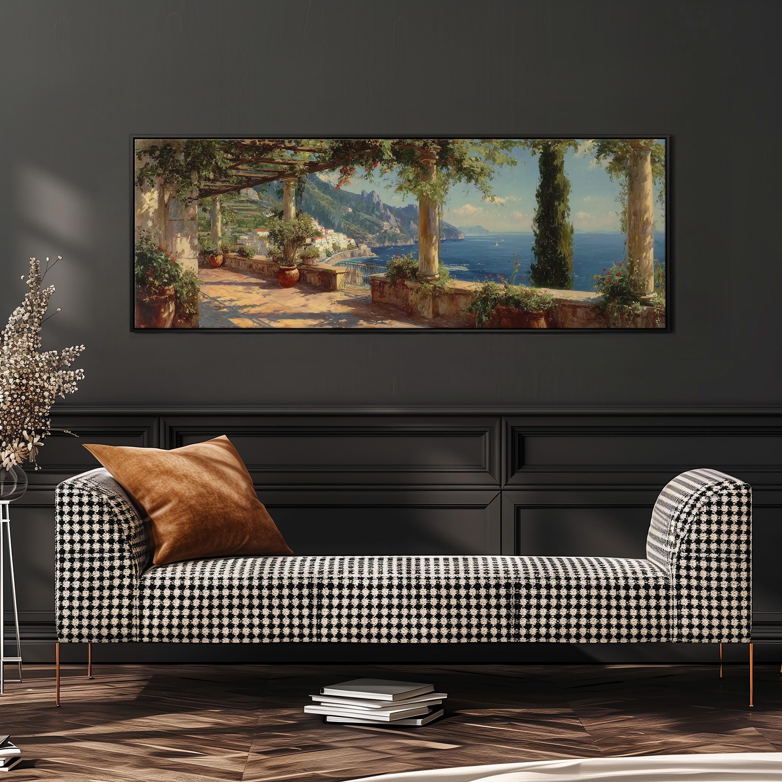 a large painting of a coastal landscape hanging on a wall above a black and white checkered sofa in a living room setting.