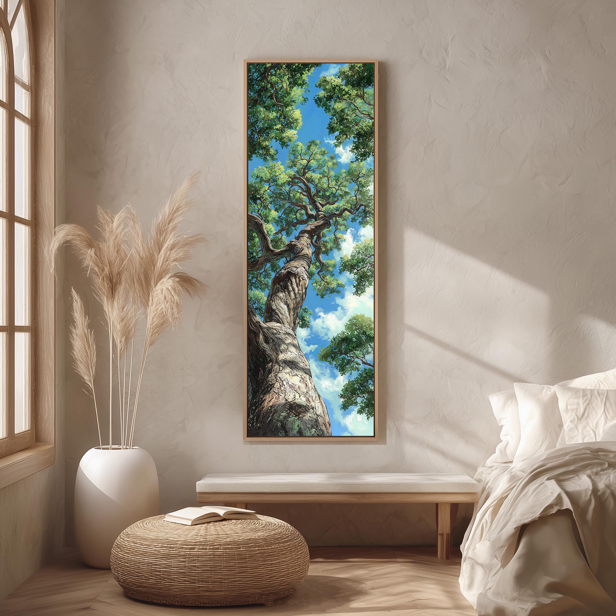 a large painting of a tree with a blue sky and green leaves hanging on a wall in a room with a bed, a window, and a woven ottoman.