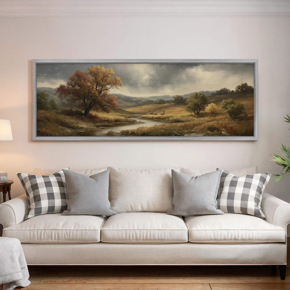 Autumn river valley under a stormy sky panoramic canvas print above a white sofa in a bright living room