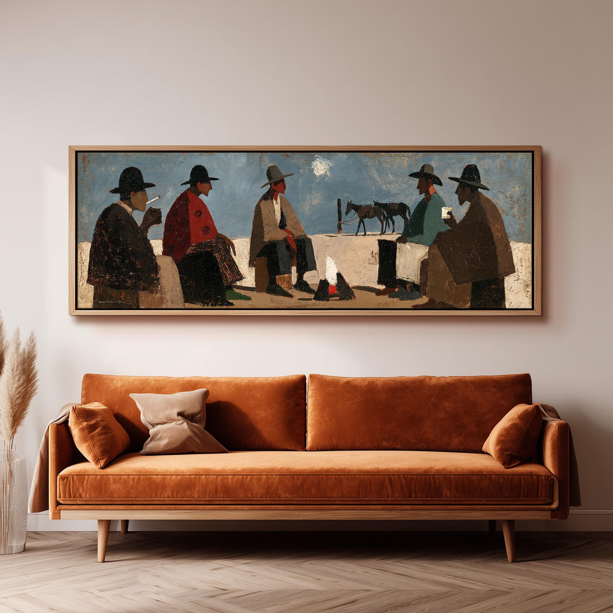Cowboys gathered around a campfire panoramic canvas print above a sofa in a living room