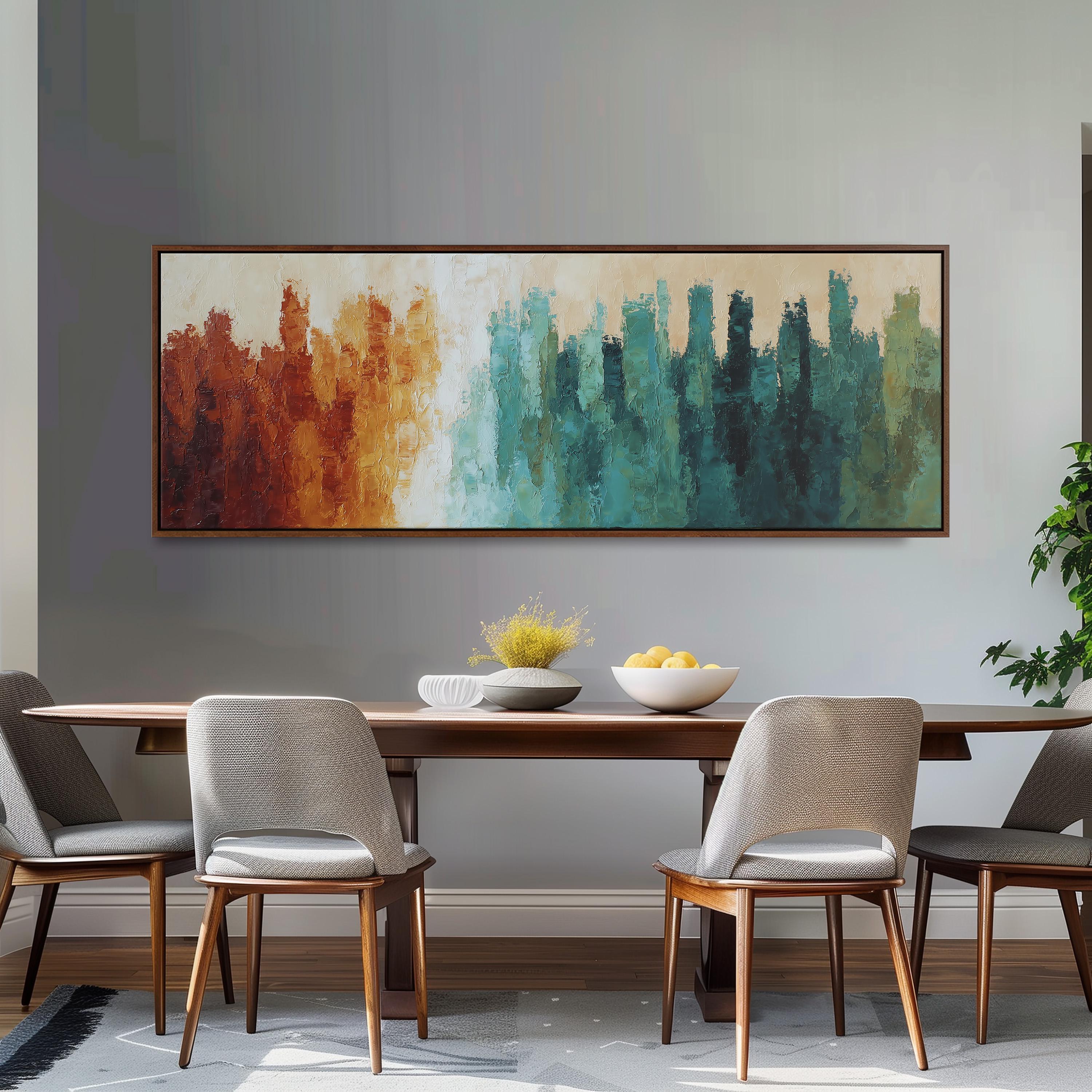 a dining room with a large abstract painting hanging on the wall above a wooden table with four chairs. The painting has a colorful, vibrant design with a mix of warm and cool tones. The table is set with a bowl of fruit and a vase of flowers, creating a welcoming and inviting atmosphere.