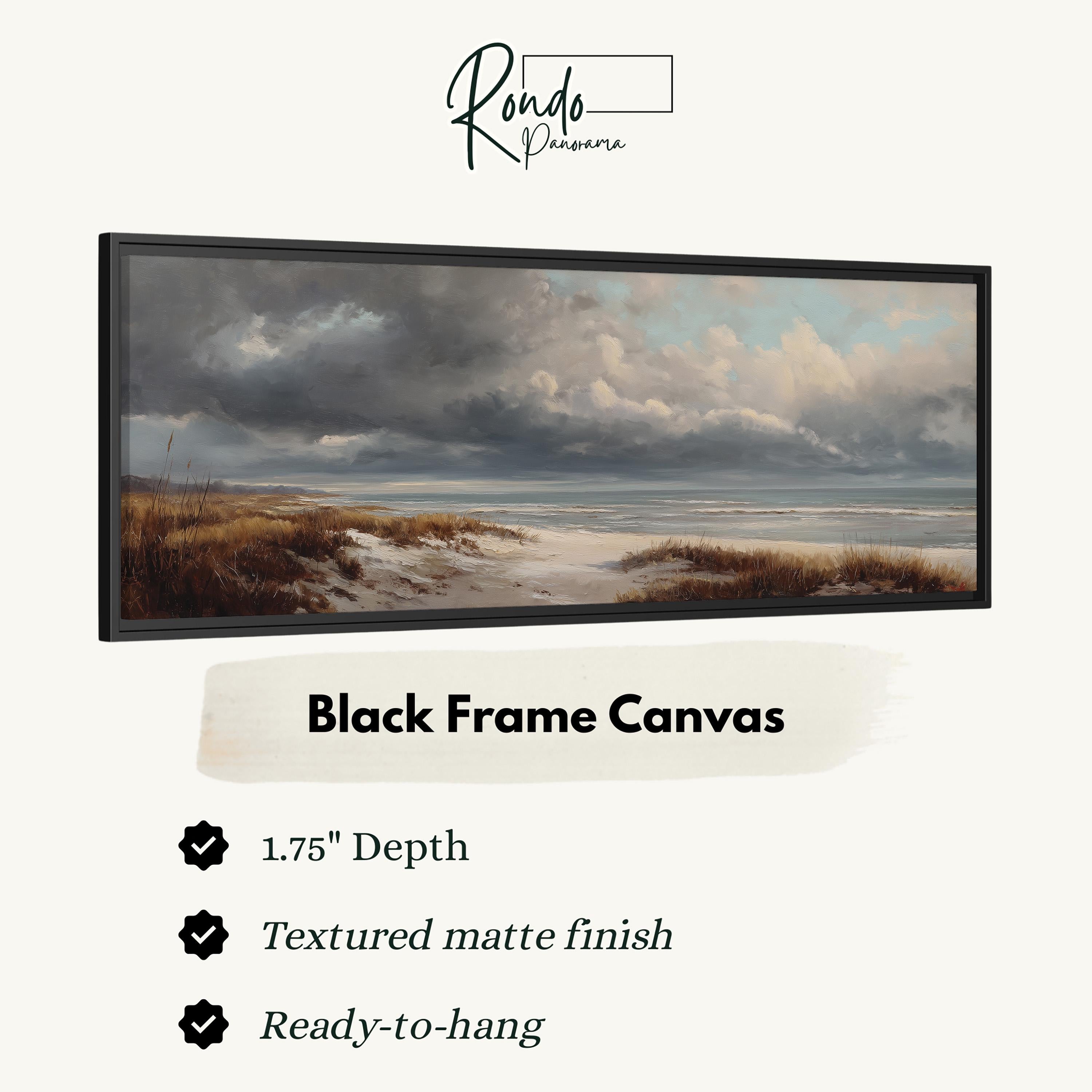 The image is a black frame canvas depicting a serene landscape with a beach and cloudy sky.