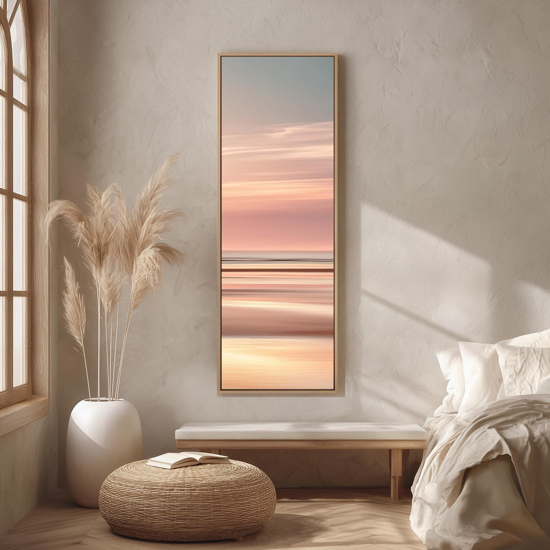 a large, framed painting of a sunset over a beach, hanging on a wall in a modern living room setting.