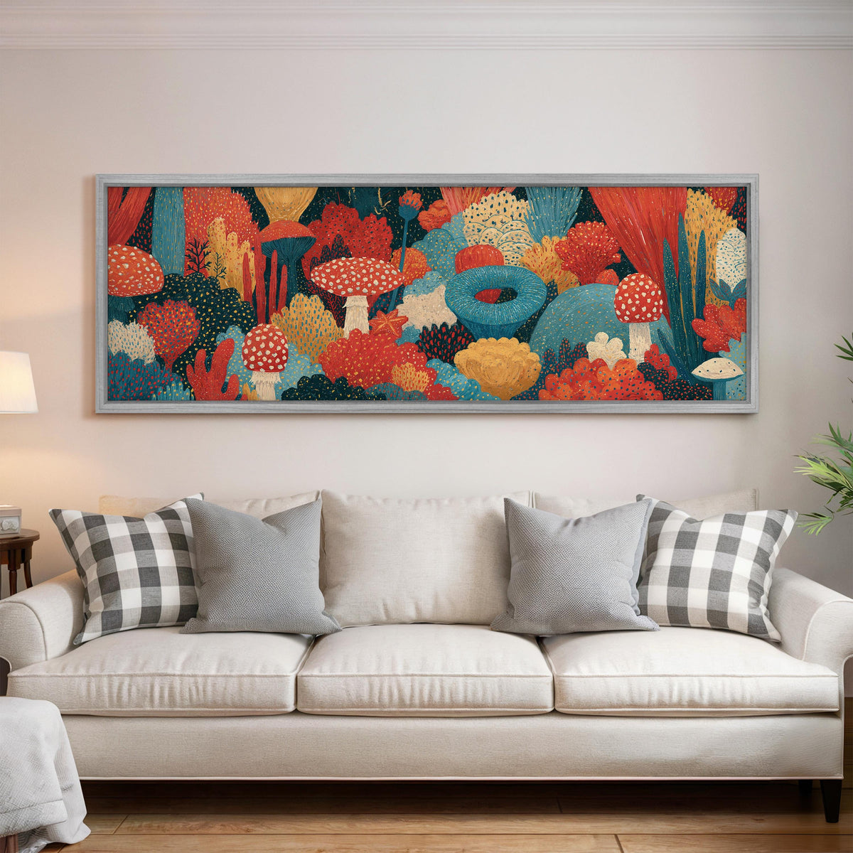 Mushroom and flower garden on teal panoramic canvas print above a white sofa in a bright living room