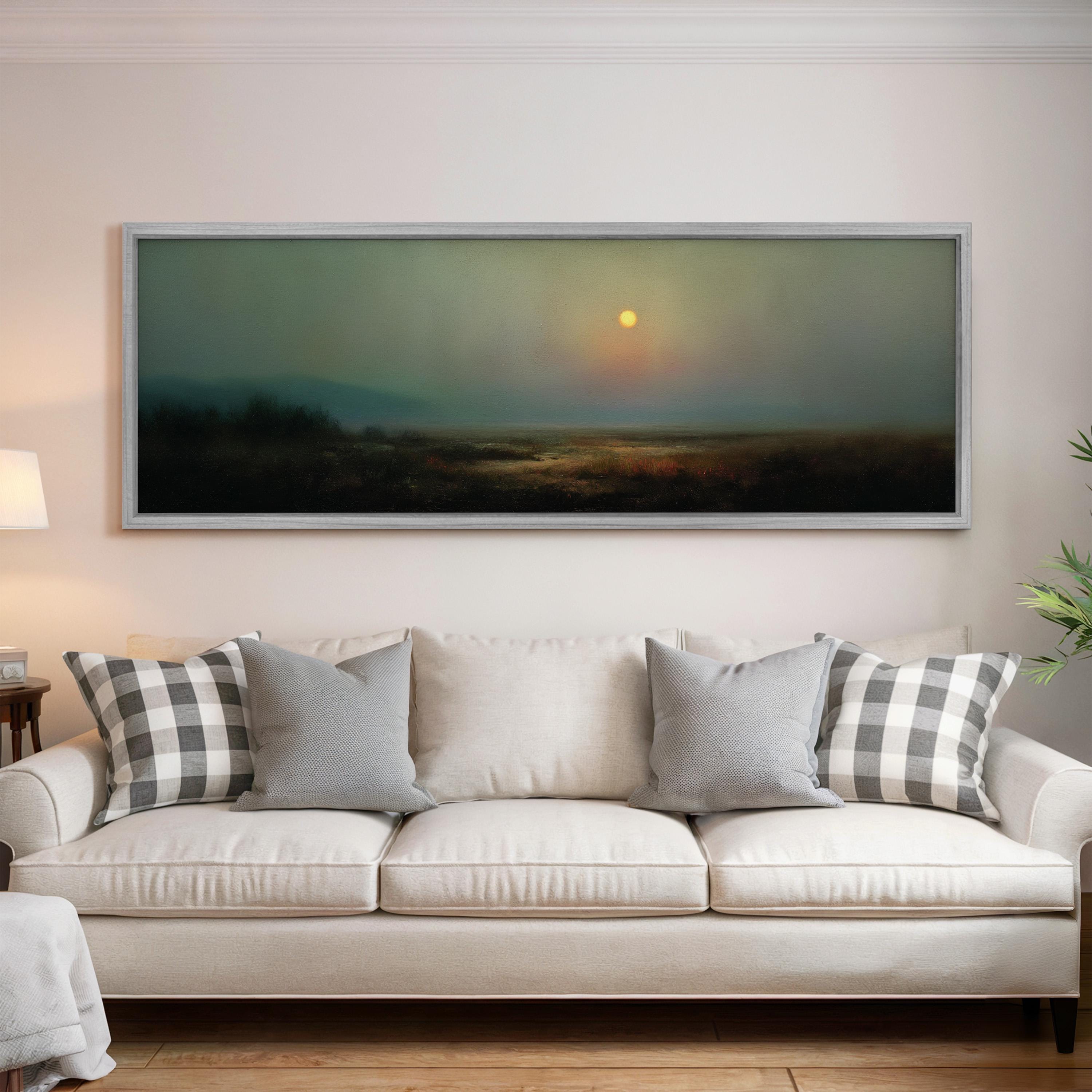 a large, framed landscape painting hanging on a wall above a white sofa with gray and white patterned pillows.